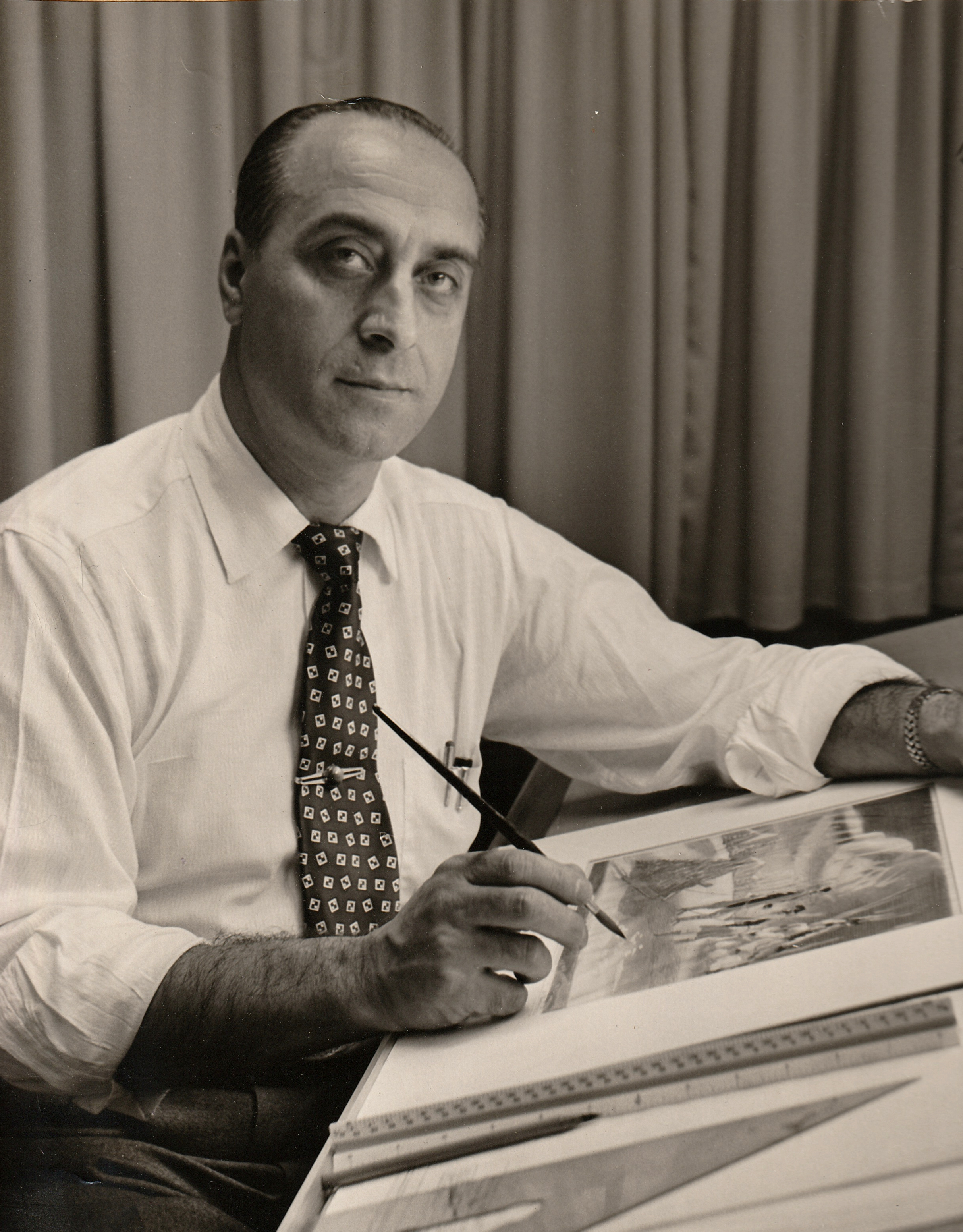 Alfred F. Muscari at his drafting table